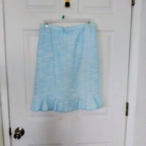 A teal colored pencil skirt with bottom flair